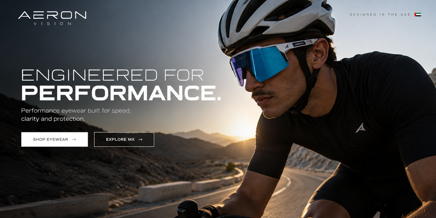 Cyclist wearing AERON performance eyewear on a mountain road